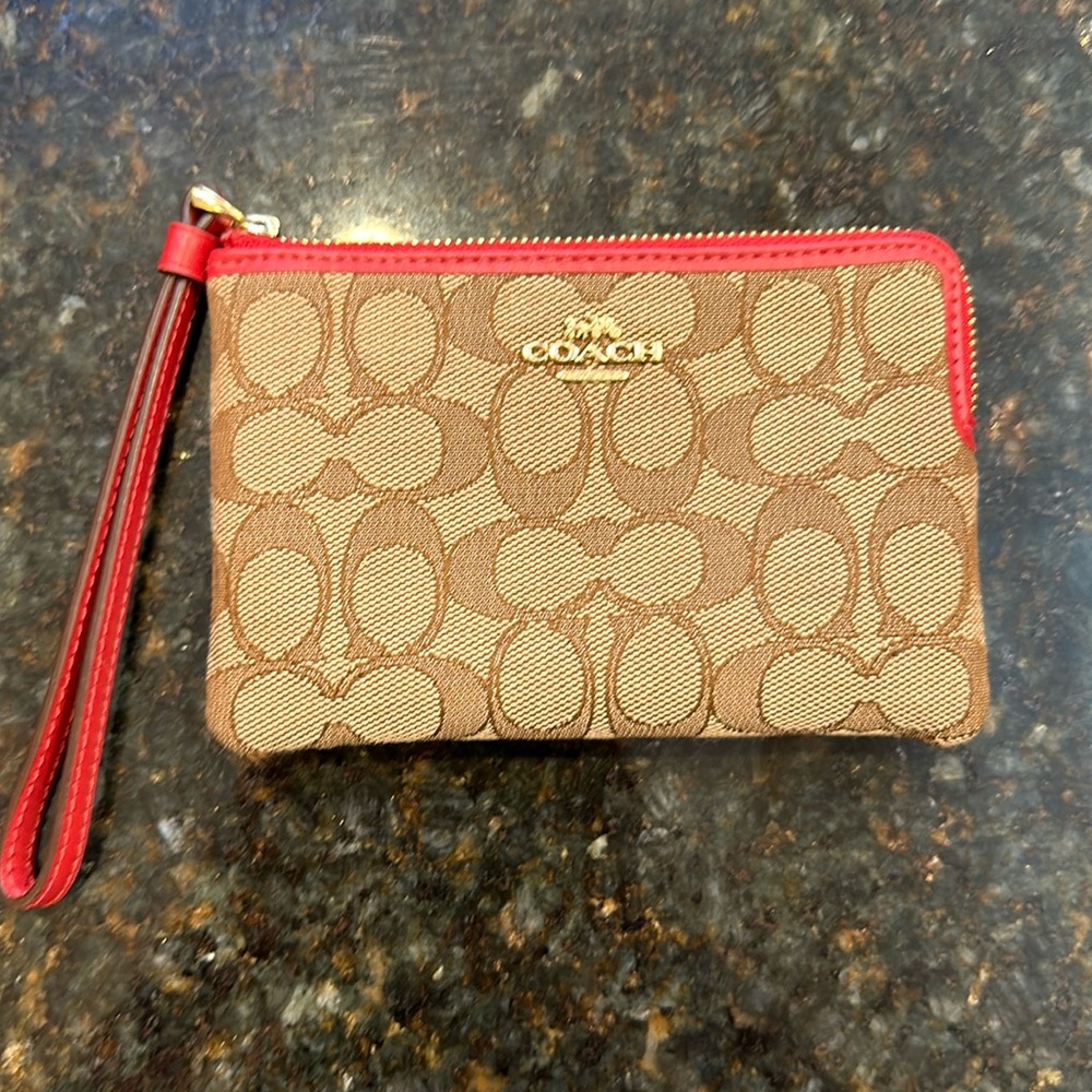 Coach wristlet with red leather trim